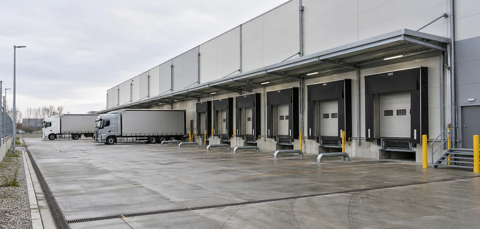 Large logistics warehouse with loading docks and truck circulation