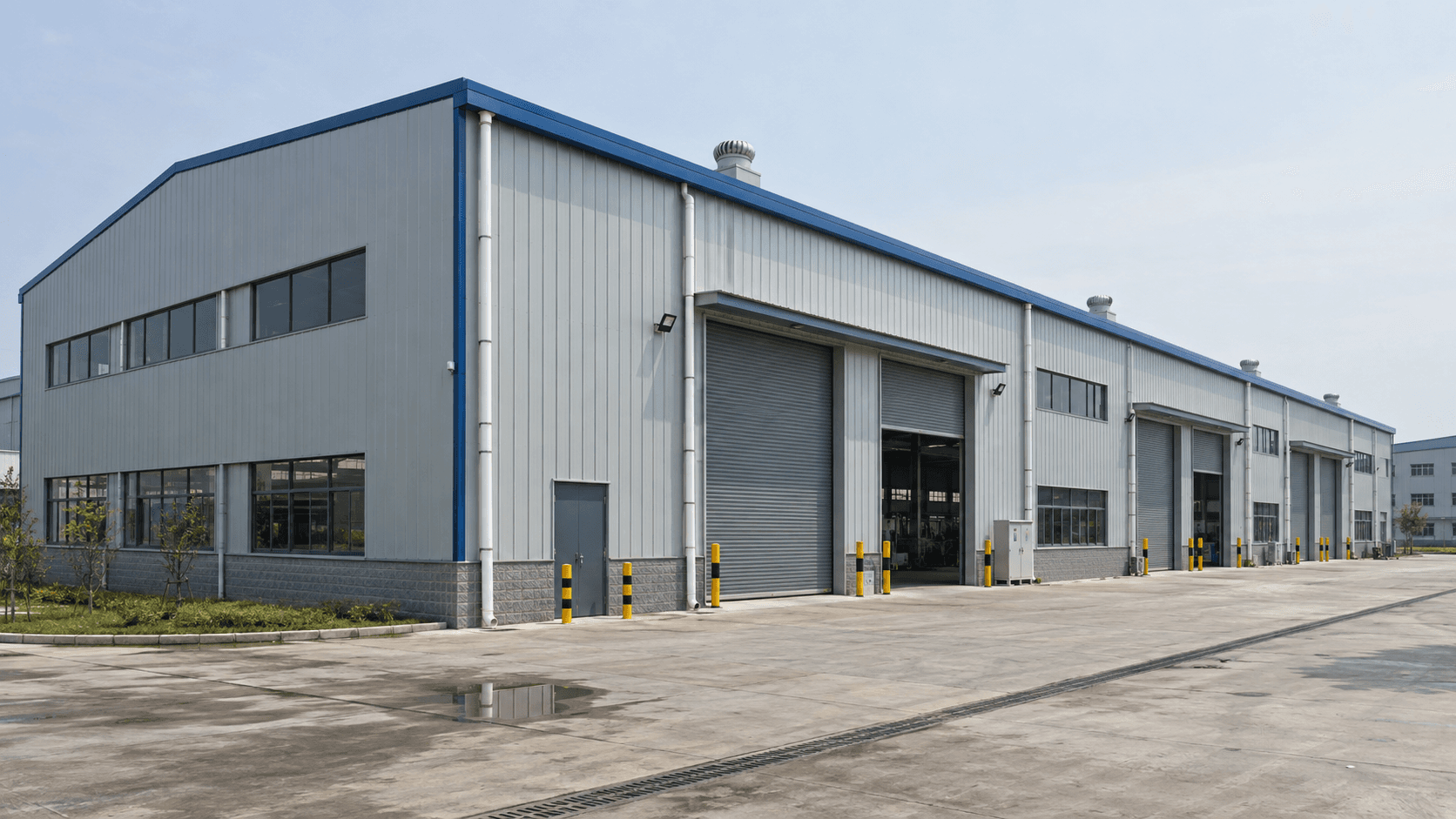 Completed steel structure manufacturing workshop with industrial access doors